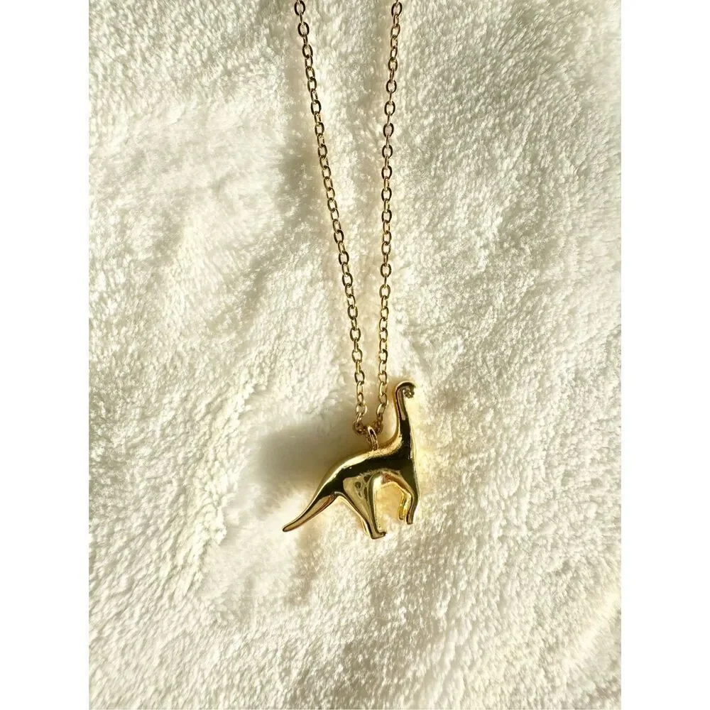 Gold color brachiosaurus pendant necklace
